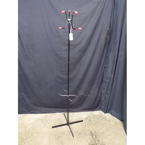 277 - Mid century metal coat/hat stand, having six coat and hat hooks with plastic terminals, supported on... 