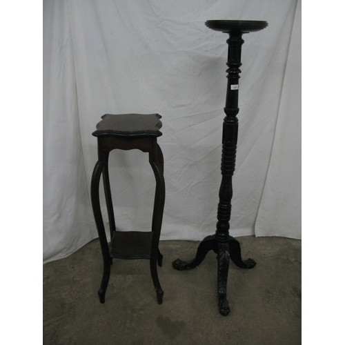 279 - Mahogany jardiniere/plantstand having a circular dish top raised on a turned column with three carve... 
