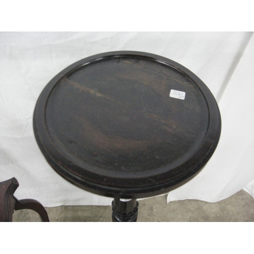 279 - Mahogany jardiniere/plantstand having a circular dish top raised on a turned column with three carve... 