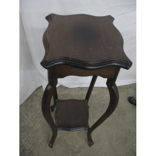279 - Mahogany jardiniere/plantstand having a circular dish top raised on a turned column with three carve... 
