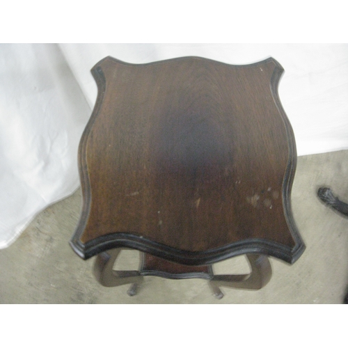 279 - Mahogany jardiniere/plantstand having a circular dish top raised on a turned column with three carve... 