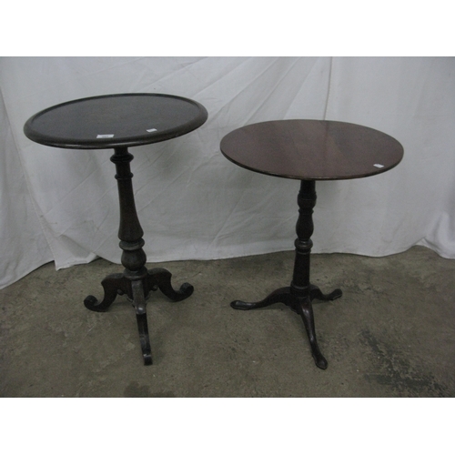285 - Two mahogany wine tables both having circular tops over turned columns and standing on tripod bases ... 