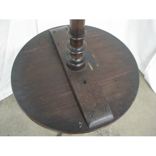 285 - Two mahogany wine tables both having circular tops over turned columns and standing on tripod bases ... 