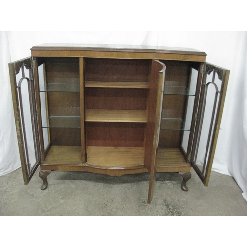 289 - Walnut display cabinet having a central bow front door, the door opening to two shelves, flanked by ... 