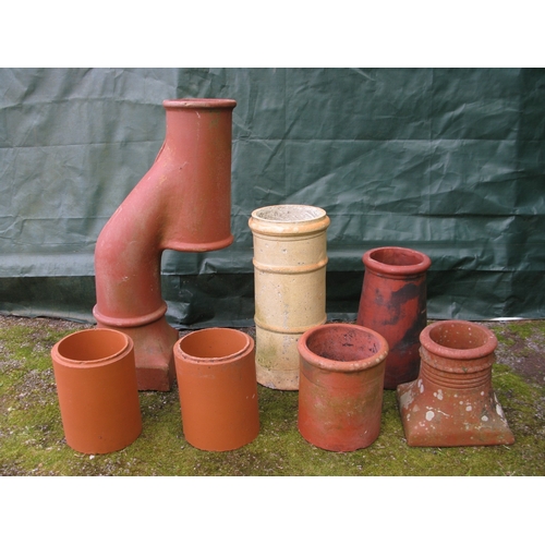 70 - Terracotta Donkey's Head chimney pot - 101cm tall together with four smaller chimney pots and two te... 