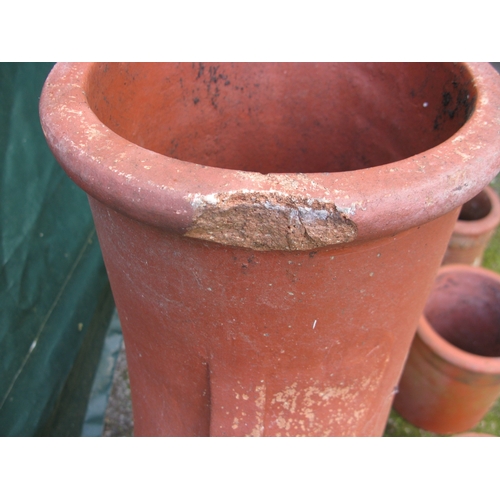 70 - Terracotta Donkey's Head chimney pot - 101cm tall together with four smaller chimney pots and two te... 