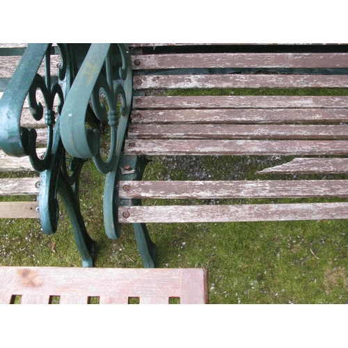 84 - Wooden slatted garden bench with iron ends - 129cm x 65cm x 78cm tall together with a wooden slatted... 