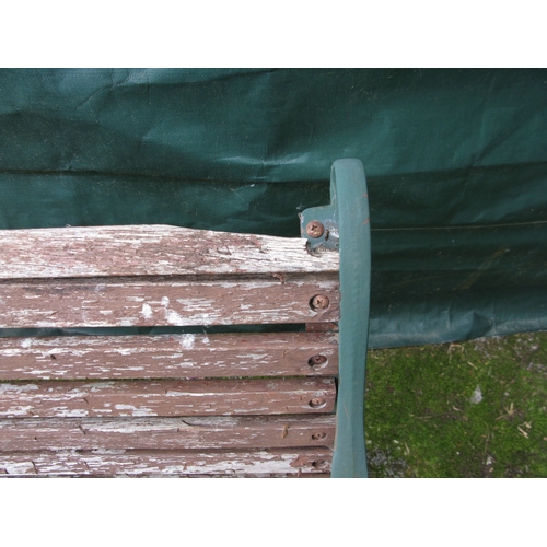 84 - Wooden slatted garden bench with iron ends - 129cm x 65cm x 78cm tall together with a wooden slatted... 
