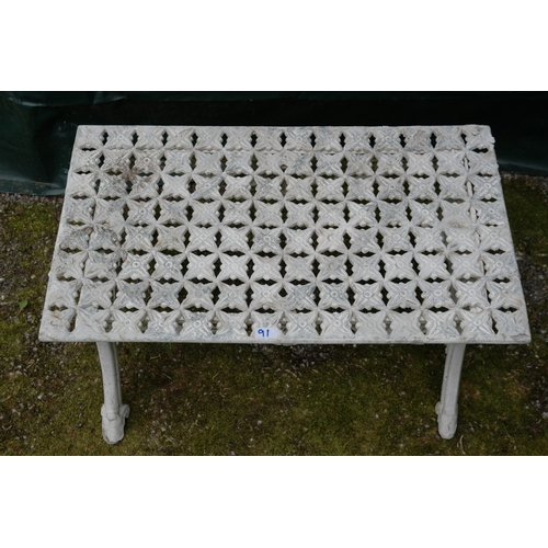 91 - White painted metal garden coffee table having pierced top and frieze, standing on swept legs - 83.5... 