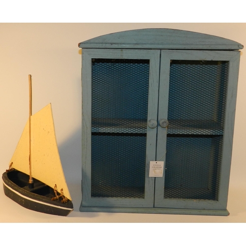 262 - Blue wooden unit with a wooden boat model