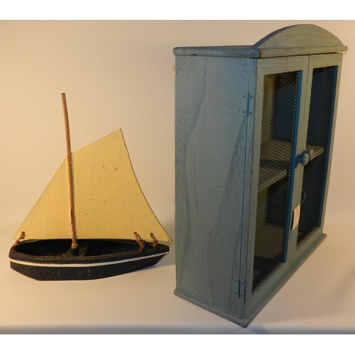 262 - Blue wooden unit with a wooden boat model