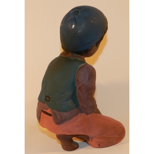 303 - Statue of a boy holding a bag of money, resin apx 23.5cm