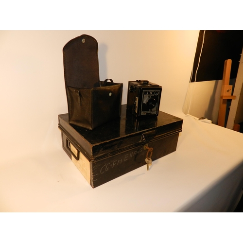 304 - Black metal box with key and camera in case 