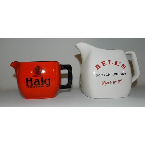 31 - Two Whiskey Jugs Bells apx 13cm height and Haig apx 10cm height