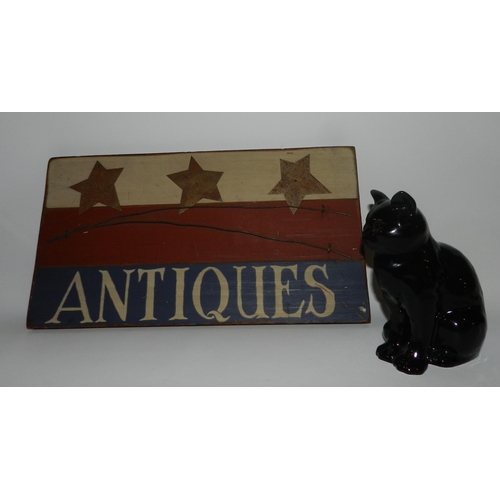 66 - Small black porcelain Cat statue with a Antique Sign apx 43cm x 23cm 