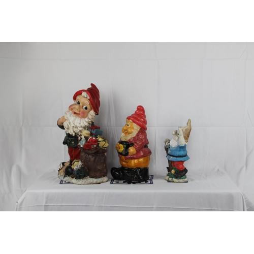 144 - Three resin Garden Gnomes, The Tallest is 19'' Inches