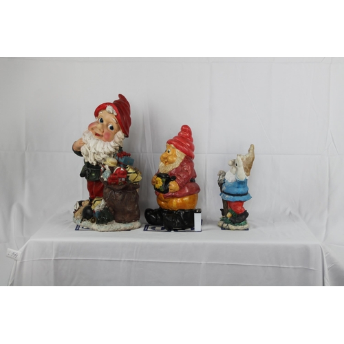 144 - Three resin Garden Gnomes, The Tallest is 19'' Inches