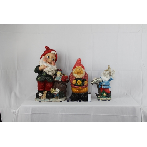 144 - Three resin Garden Gnomes, The Tallest is 19'' Inches