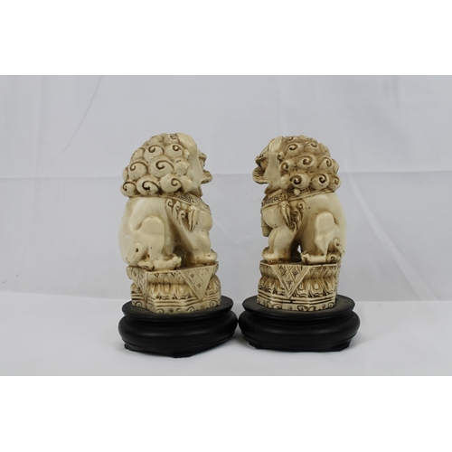 74 - Vintage Resin Carved Foo Dogs on Wooden Stand, in mint condition, 16 cm tall