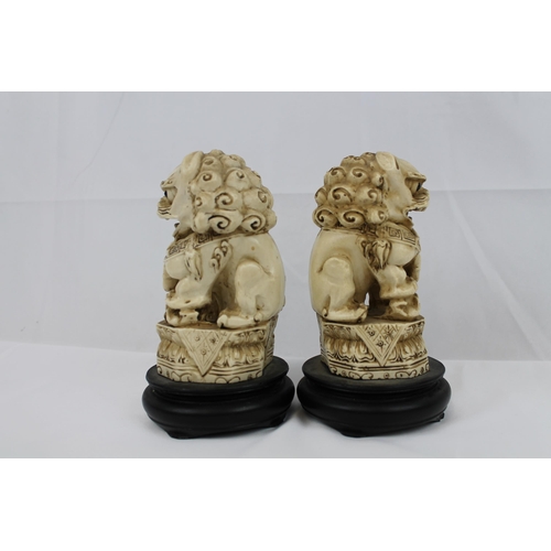 74 - Vintage Resin Carved Foo Dogs on Wooden Stand, in mint condition, 16 cm tall