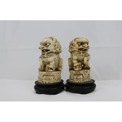 74 - Vintage Resin Carved Foo Dogs on Wooden Stand, in mint condition, 16 cm tall