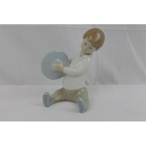 180 - Lladro Porcelain Figure of a Boy Playing Cymbals in mint condition, 15 cm tall