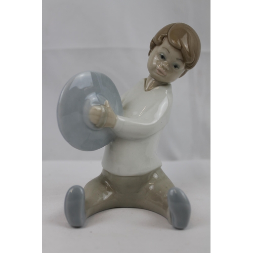 180 - Lladro Porcelain Figure of a Boy Playing Cymbals in mint condition, 15 cm tall