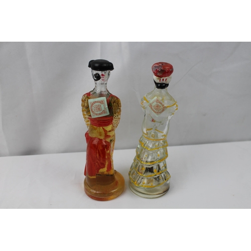 435 - Vintage Hand Painted Brandy Matador & Lady Bottles, 17 cm tall