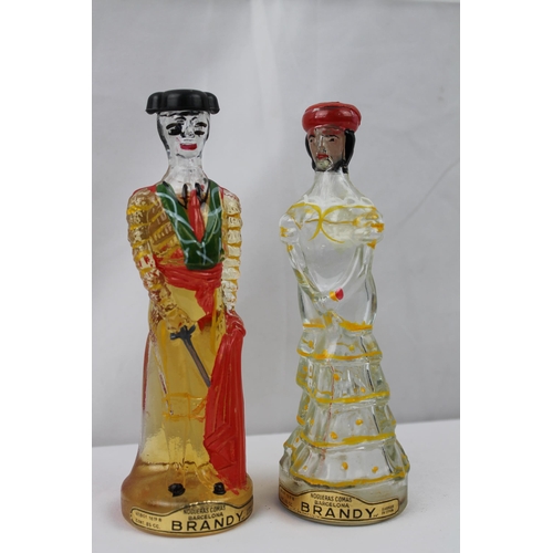 435 - Vintage Hand Painted Brandy Matador & Lady Bottles, 17 cm tall