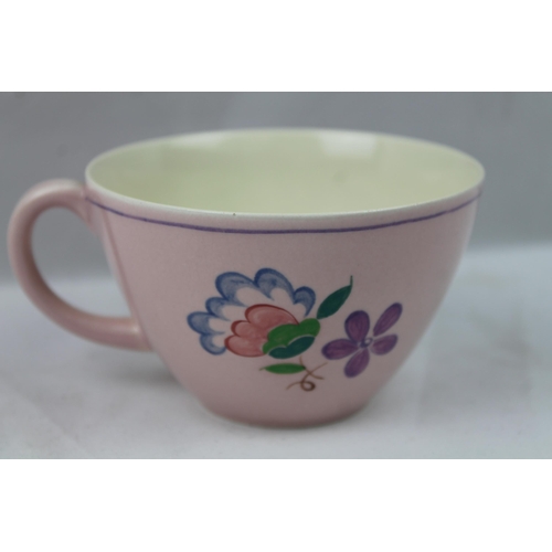 102 - Poole Pottery Tea Cup, 9.5 cm in diameter