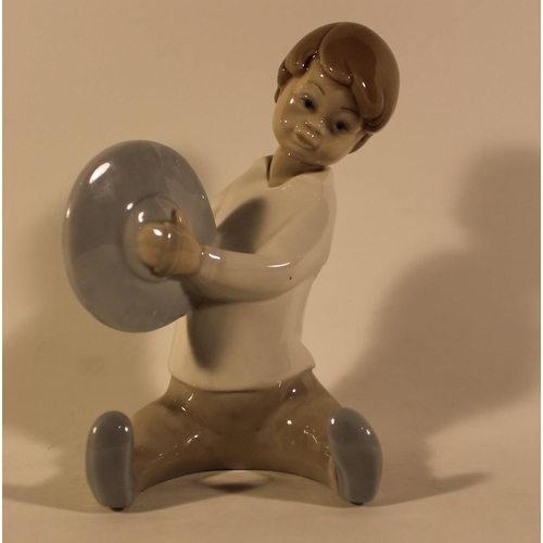 47 - Lladro Porcelain Figure of a Boy Playing Cymbals in mint condition, 15 cm tall