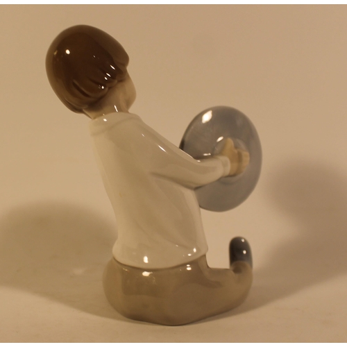 47 - Lladro Porcelain Figure of a Boy Playing Cymbals in mint condition, 15 cm tall