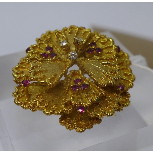 1005 - An 18ct yellow gold, flower-head brooch composed of eighteen gold petals studded with a total of thr... 
