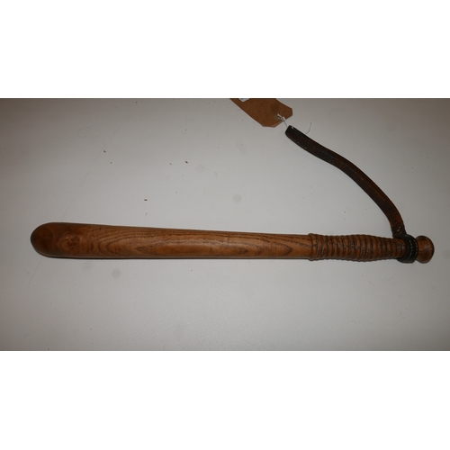 91 - A Military Police oak truncheon, with leather strap, stamped MP and with crown, L.45cm