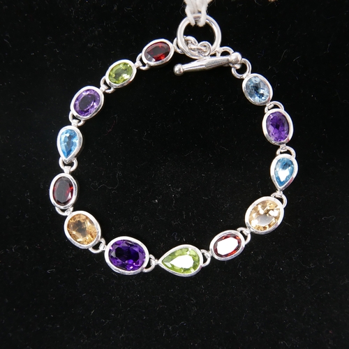 93 - A sterling silver and muti-gem set necklace set with faceted amethysts, peridot, garnet, citrine and... 