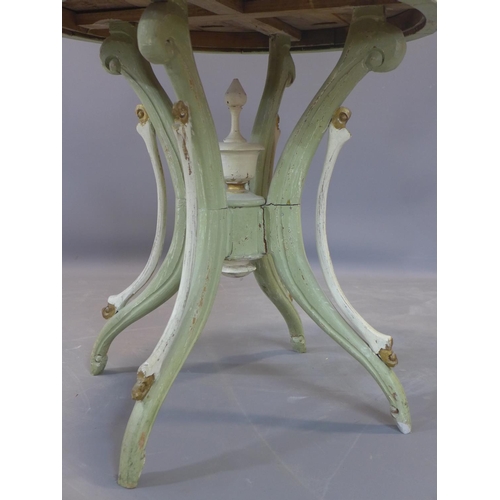 24 - A distressed painted circular table, on outswept legs, H.69cm Diameter 69cm