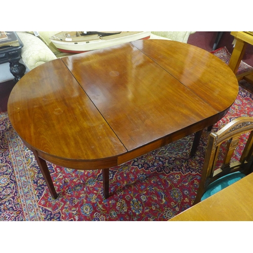 29 - A mahogany D-end dining table, with extra leaf, raised on tapered legs, H.73 W.127cm, leaf depth 73c... 
