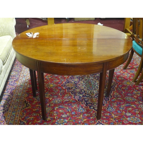 29 - A mahogany D-end dining table, with extra leaf, raised on tapered legs, H.73 W.127cm, leaf depth 73c... 