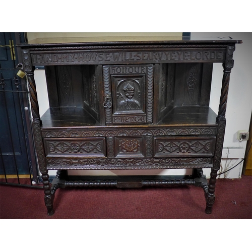 23 - A 19th century stained oak sideboard, with central cupboard door above two short drawers, raised on ... 