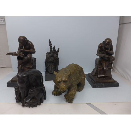 1 - A collection of bronze animals, including two reading monkeys, a bear, a mouse, and a group of eleph... 