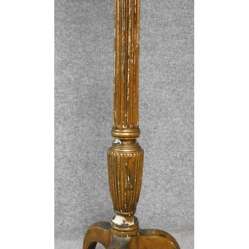 57 - An antique giltwood torchere on turned fluted pedestal support terminating on tripod cabriole feet. ... 