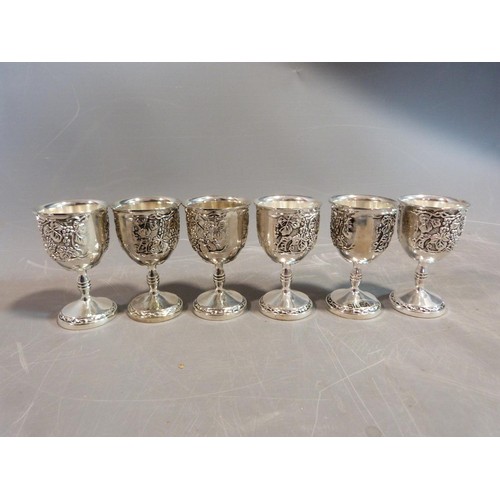 10 - A set of six white metal silea vine design kiddush cups. H.8cm.