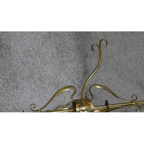 460 - Two early 20th century three branch brass ceiling lights, one with floral swag design and the other ... 
