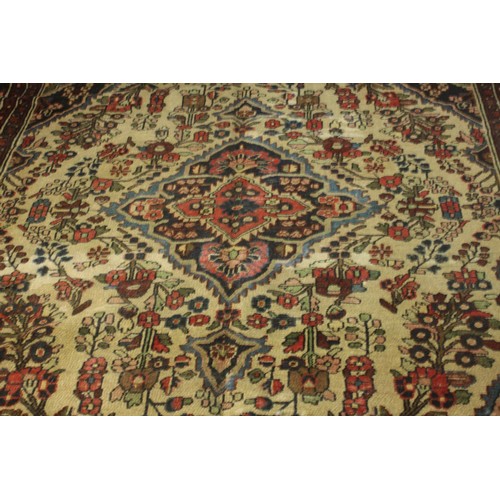 482 - A Persian Hamadan cream ground hand made carpet. L.280 W.230cm.
