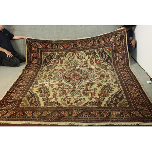 482 - A Persian Hamadan cream ground hand made carpet. L.280 W.230cm.