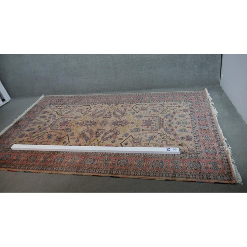 300 - A handmade Indian part-silk Agra carpet, on a beige ground. L.290 W.188cm.