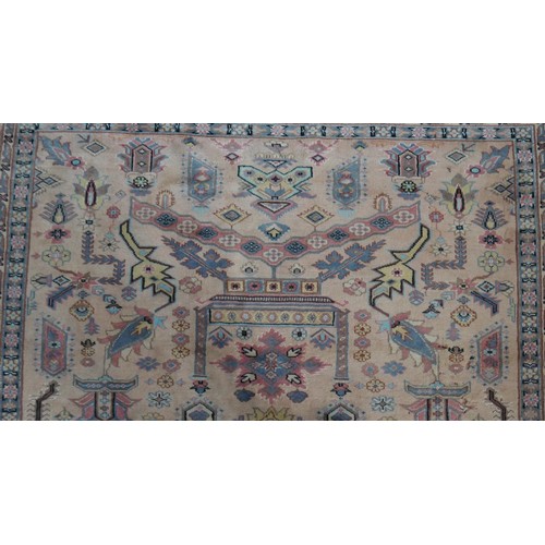 300 - A handmade Indian part-silk Agra carpet, on a beige ground. L.290 W.188cm.