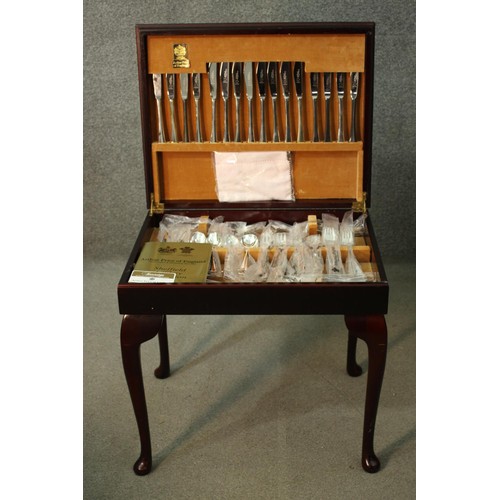 317 - An as new Arthur Price canteen of silver plated Country Plate flatware, mahogany cased with a tan to... 