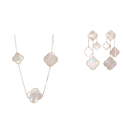 130 - 18k and mother of pearl set long chain with matching earrings, the necklet set with thirteen plaques... 