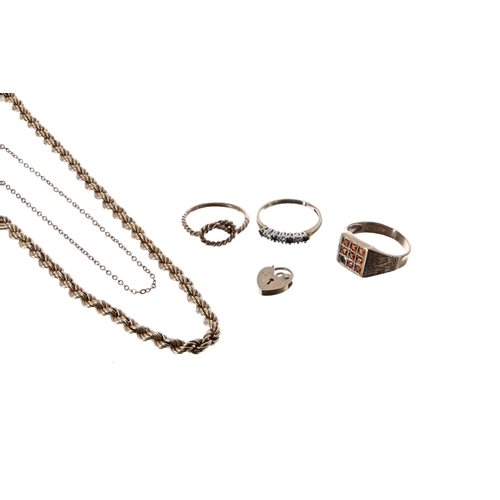 137 - Two 9ct necklaces, three 9ct rings and a 9ct padlock, 15.3gm (350)